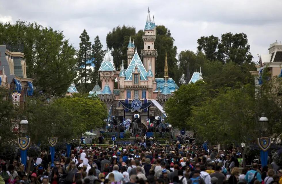 FILE PHOTO: People are seen on the Main Street during Disneyland's Diamond Celebration in Anaheim, California May 22, 2015. REUTERS/Mario Anzuoni/File Photo