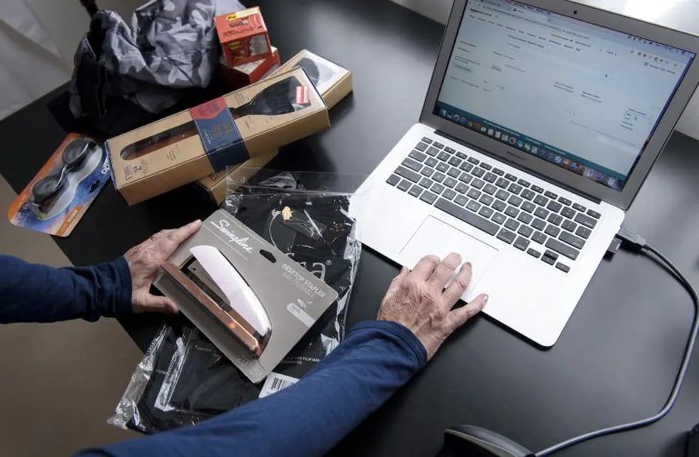 A liquidation reseller uses a laptop computer to check Amazon.com Inc. buyers interested in merchandise at her home in Napa, California, U.S., on Thursday, March 14, 2019. As overwhelmed retailers search for cost-effective ways to recover more cash from the flood of returned goods, resellers of all sizes are stepping into the void. Photographer: Michael Short/Bloomberg