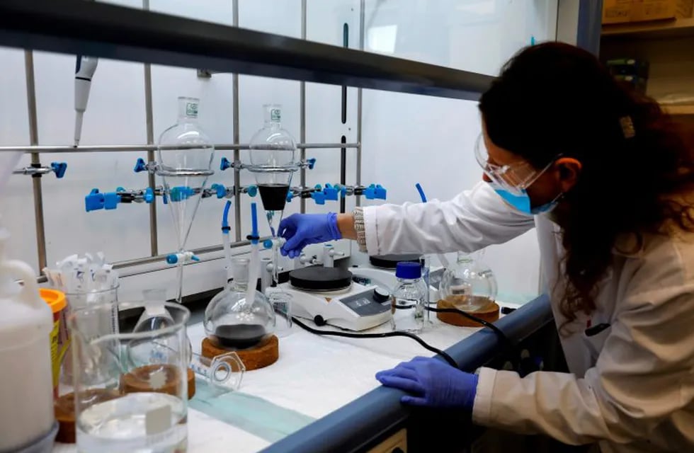 A technician works at the laboratory of NanoScent's headquarters in Misgav industrial zone near the northern Israeli city of Karmiel, on July 21, 2020. - An Israeli company is developing a coronavirus breathalyser test that gives results in 30 seconds, billing it as a \