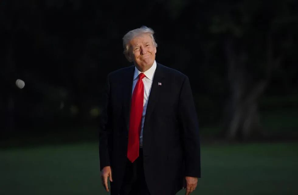 U.S. President Donald Trump smiles as he returns to the White House in Washington, D.C., U.S., on Saturday, July 8, 2017. Home from the Group of 20 meeting, Trump tweeted that it’s time to begin working constructively with Russia, and that he’d discussed creating a cybersecurity unit with Russian President Vladimir Putin. Photographer: Olivier Douliery/Pool via Bloomberg