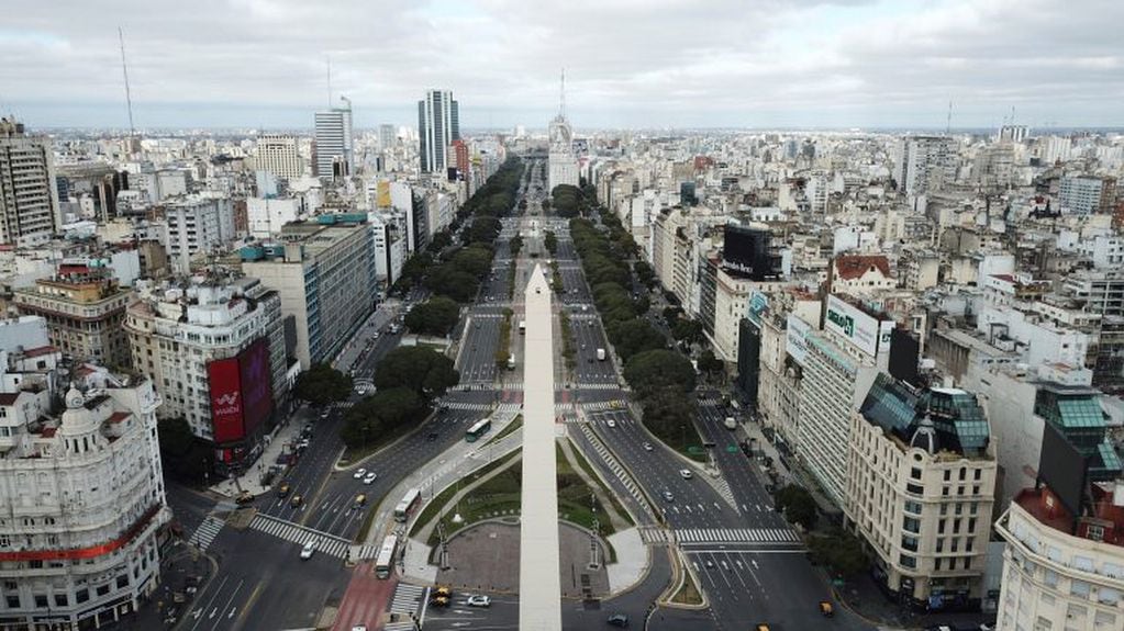 The 9 de Julio Boulevard is seen almost devoid of traffic during the return to a strict lockdown to curb the spread of COVID-19, in Buenos Aires, Argentina, Wednesday, July 1, 2020. After a brief relaxation of a government lockdown, authorities returned to tighter restrictions in the capital when cases spiked. (AP Photo/Victor R. Caivano)