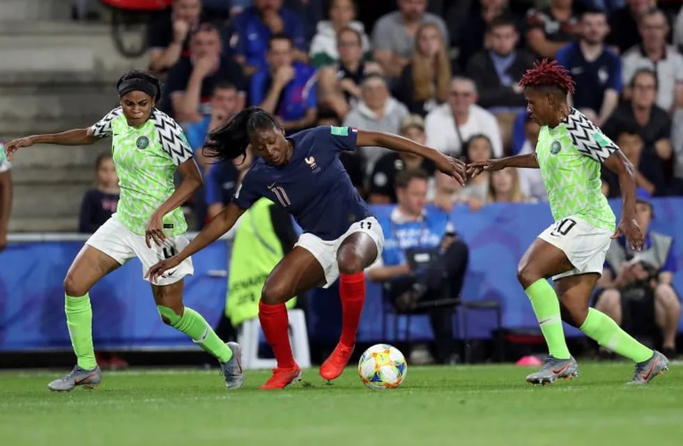 France's Kadidiatou Diani, middle, is challenged by Nigeria's Rita Chikwelu, right, as teammate Ngozi Ebere watches on during the Women's World Cup Group A soccer match between Nigeria and France at the Roazhon Park in Rennes, France, Monday, June 17, 2019. (AP Photo/Vincent Michel)
