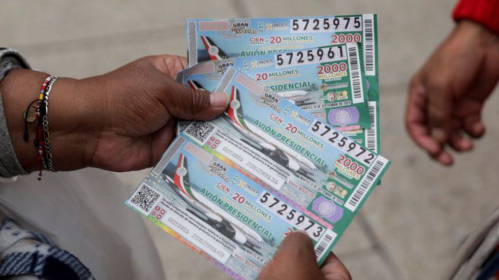 A Mexican lottery salesman shows lottery tickets for a Mexico luxury presidential plane for sale at a raffle ticket booth as Mexico's government on Monday made a final push to sell lottery tickets for the value of the last president's luxury jet, in Mexico City, Mexico September 14, 2020. REUTERS/Henry Romero