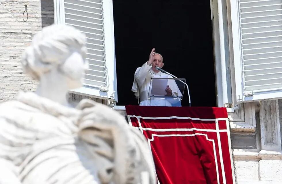 Pope Francis blesses the crowd from the window of the  apostolic palace overlooking St Peter's square during the Sunday Angelus prayer, on June 7, 2020, in the Vatican. (Photo by Andreas SOLARO / AFP)