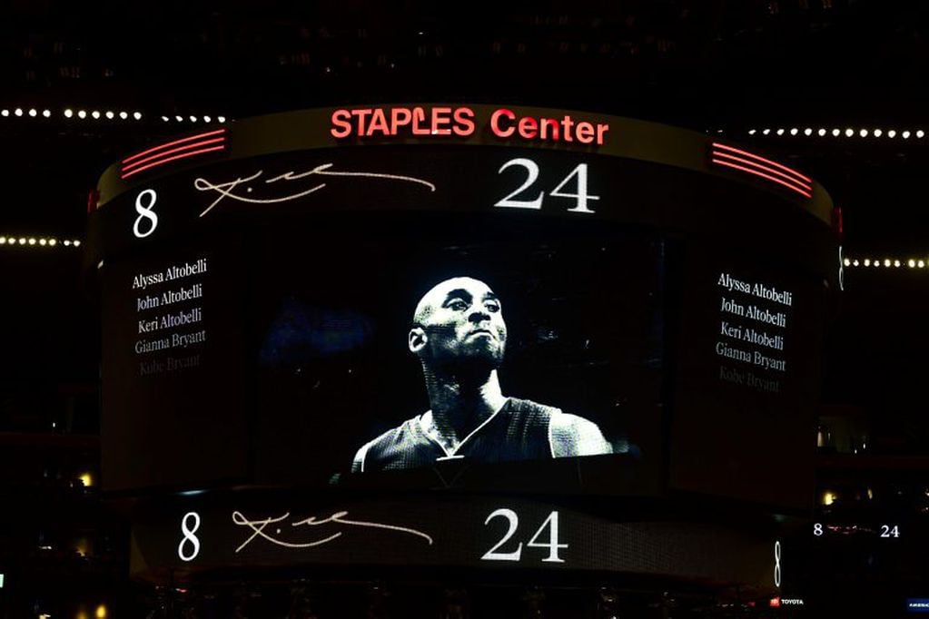 TOPSHOT - NBA legend Kobe Bryant image appears on a screen at the Staples Center ahead of a game between Los Angeles Lakers and Portland Trail Blazers, after Bryant was killed last weekend in a helicopter accident, in Los Angeles, California on January 31, 2020. (Photo by FREDERIC J. BROWN / AFP)