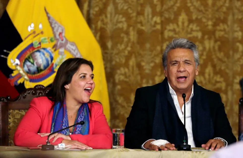 Ecuador's President Lenin Moreno, right, and vice president Alejandra Vicuna sing as they celebrate that his proposal of Referendum has been approved by Ecuadoreans in Quito, Ecuador, Sunday, Feb. 4, 2018. Ecuadoreans have voted overwhelmingly to limit presidents to two terms in a nationwide referendum that was seen as a critical test of former President Rafael Correa's enduring political strength.  (AP Photo/Dolores Ochoa)