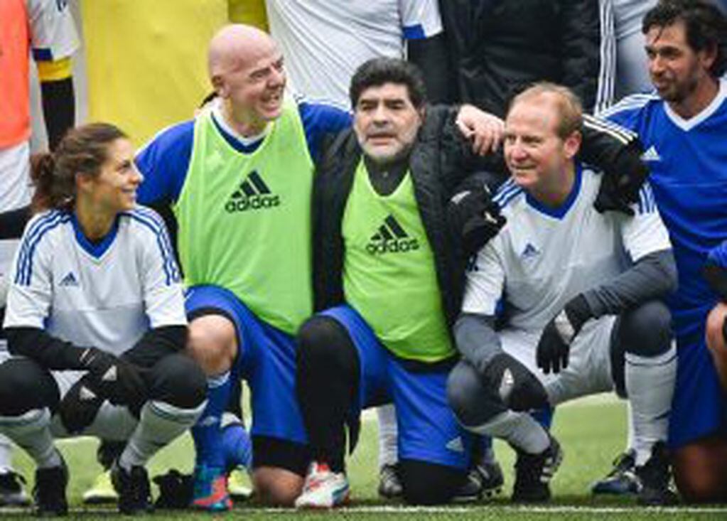FIFA president Gianni Infantino (2nd L) and Argentinian retired professional footballer Diego Armando Maradona (C) poses with football player legends for a group picture after a FIFA Football Legends football game ahead of The Best FIFA Football Awards 20