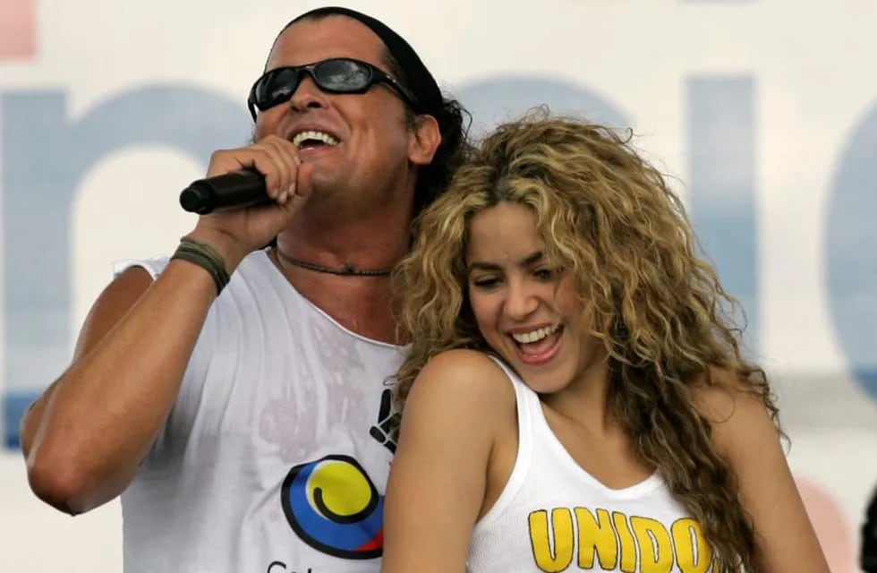 FILE - In this July 20, 2008 file photo, Colombian singers Shakira, right, and Carlos Vives perform during a 