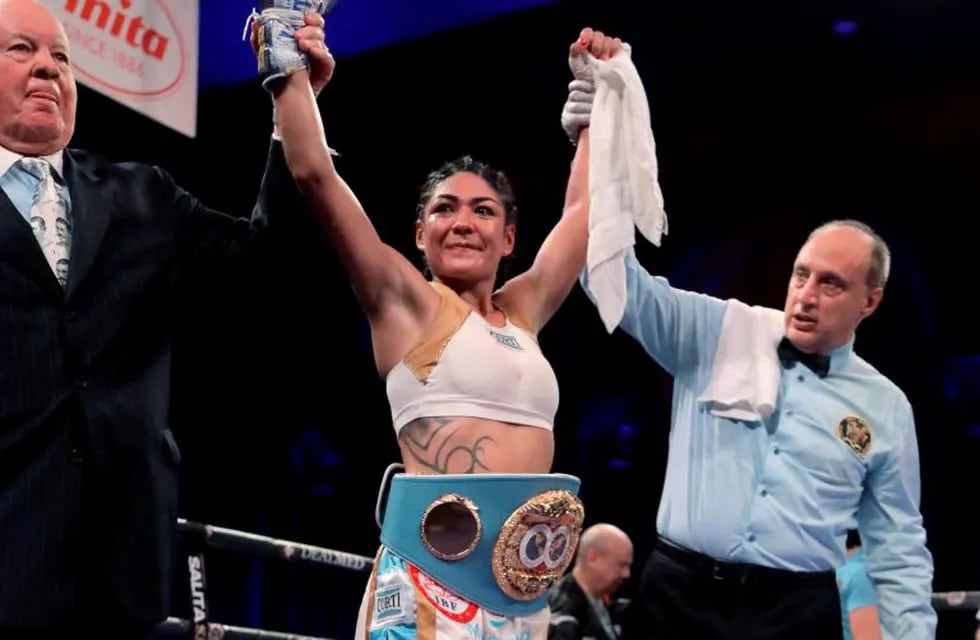 Brenda Karen Carabajal wears the belt after defeating Elena Gradinar during a women's featherweight IBF world championship boxing bout Saturday, April 13, 2019, in Atlantic City, N.J. (AP Photo/Julio Cortez)