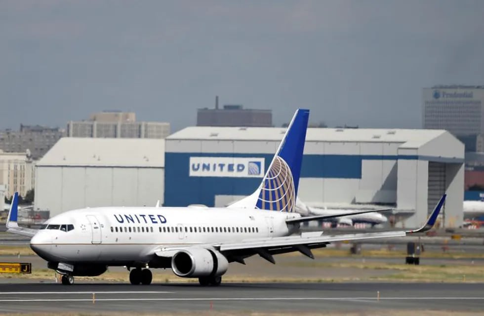 FILE - In this Sept. 8, 2015, file photo, a United Airlines passenger plane lands at Newark Liberty International Airport in Newark, N.J. United said on Monday, March 27, 2017, that regular-paying fliers are welcome to wear leggings aboard its flights, ev