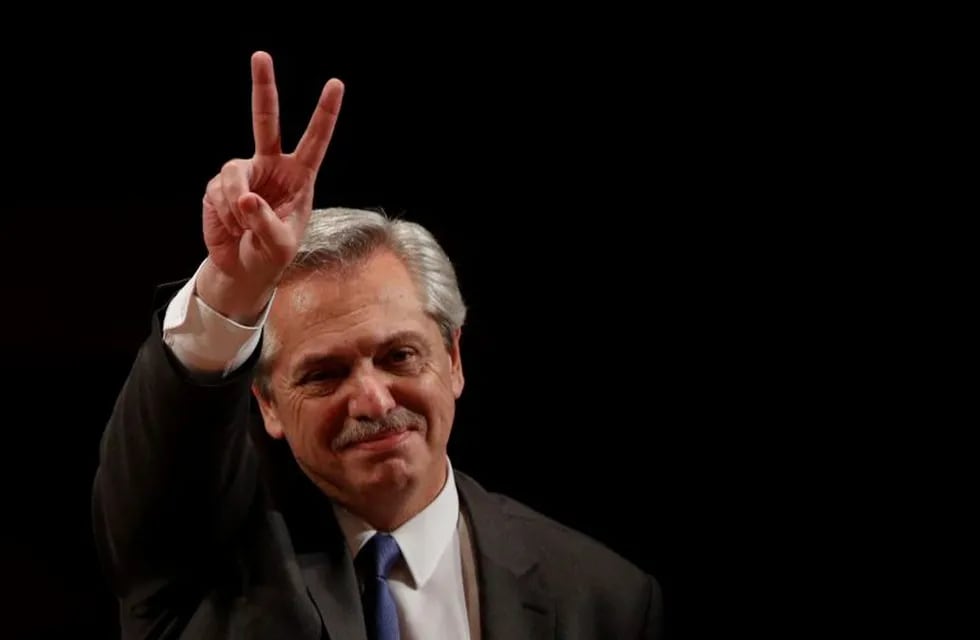 FILE - In this Nov. 5, 2019 file photo, Argentina's President-elect Alberto Fernandez gestures to supporters as he arrives to give a talk on the challenges facing Latin America, hosted by Mexico's National Autonomous University in Mexico City. Fernandez becomes president of Argentina on Tuesday Dic. 10, returning the country's Peronist political movement to power amid an economic crisis and rising poverty. (AP Photo/Rebecca Blackwell, File)