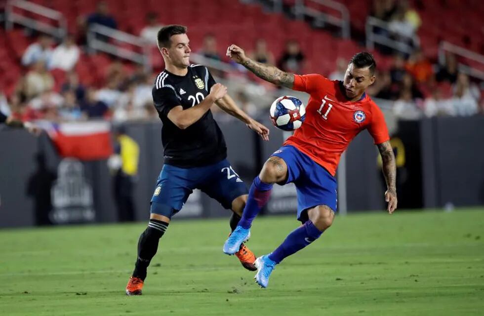 Chile's Eduardo Vargas, right, is defended by Argentina's Giovani Lo Celso during the first half of an international friendly soccer match Thursday, Sept. 5, 2019, in Los Angeles. (AP Photo/Marcio Jose Sanchez)