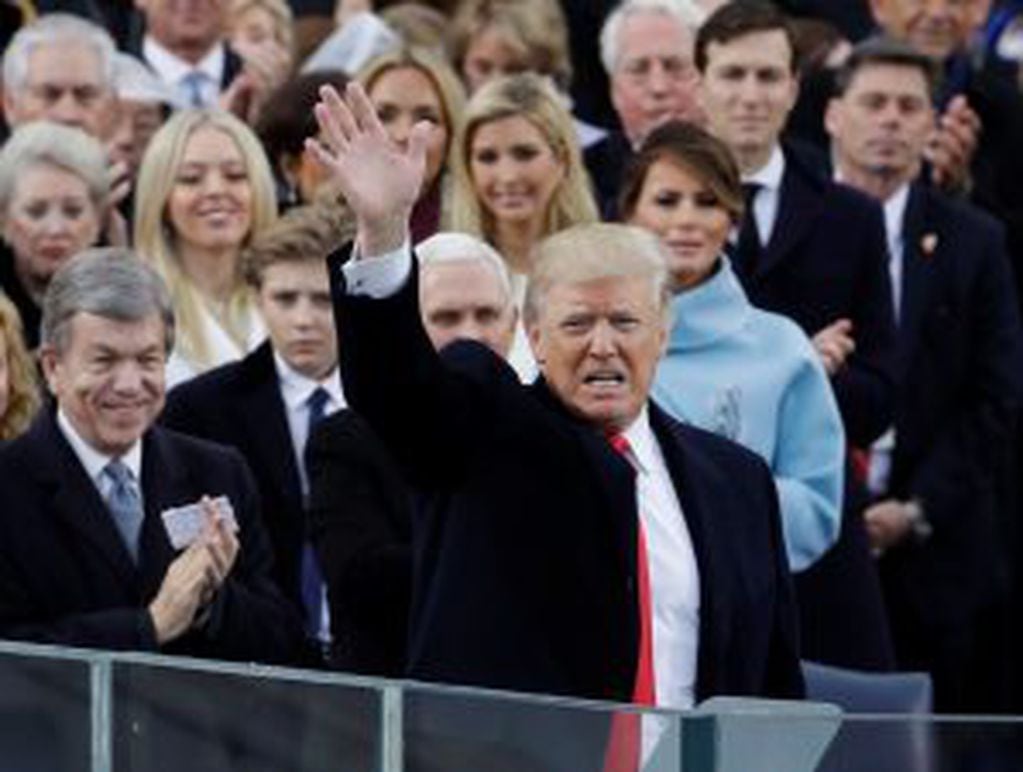 President Donald Trump waves after delivering his inaugural address after being sworn in as the 45th president of the United States during the 58th Presidential Inauguration at the U.S. Capitol in Washington, Friday, Jan. 20, 2017.(AP Photo/Patrick Semansky)