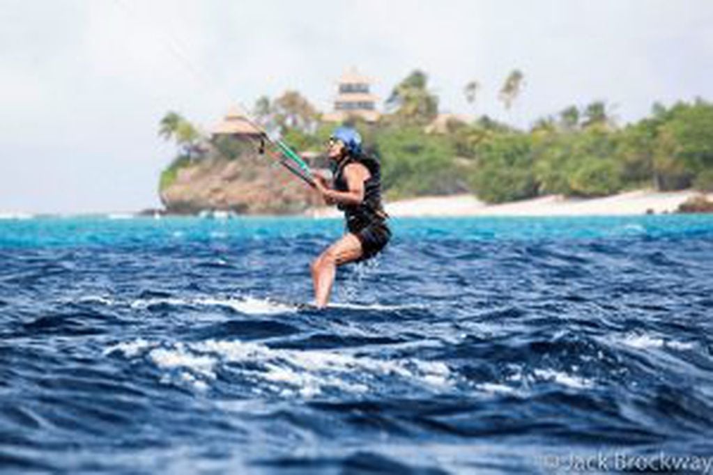 In this recent but undated photo made available by Virgin.com, former U.S President Barack Obama kitesurfs during his stay on Moskito Island, British Virgin Islands. The former president and his wife stayed on Mosikto Island owned by Richard Branson, foun