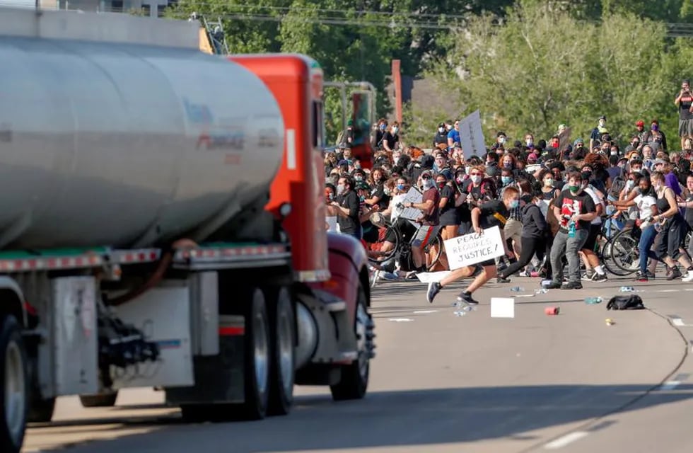 A tanker truck drives into thousands of protesters marching on 35W north bound highway during a protest against the death in Minneapolis police custody of George Floyd, in Minneapolis, Minnesota, U.S. May 31, 2020. REUTERS/Eric Miller     TPX IMAGES OF THE DAY