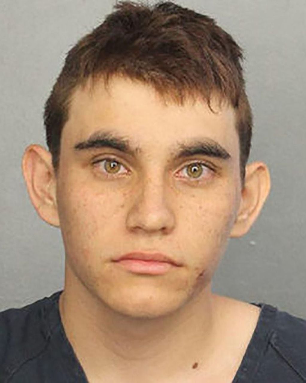 TOPSHOT - This booking photo obtained February 15, 2018 courtesy of the Broward County Sheriff's Office shows shooting suspect Nikolas Cruz.

Authorities in Florida could offer no explanation Wednesday night as to why a former student armed with an AR-15 rifle opened fire at a high school earlier that day, killing at least 17 people. Broward County Sheriff Scott Israel identified the gunman as Nikolas Cruz, 19, a former student at Marjory Stoneman Douglas High School in Parkland who had been expelled for "disciplinary reasons," but was currently enrolled in Broward County Public Schools.Cruz, whose fellow students described him as "troubled," was arrested without incident in the nearby town of Coral Springs after the Valentine's Day rampage and taken to hospital with minor injuries, the sheriff said.
 / AFP PHOTO / Broward County Sheriff's Office / Handout / RESTRICTED TO EDITORIAL USE - MANDATORY CREDIT "AFP PHOTO / BROWARD COUNTY SHERIFF'S OFFICE/HANDOUT" - NO MARKETING NO ADVERTISIN