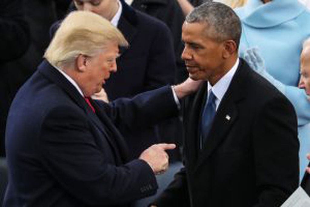 President Donald Trump points at Former President Barack Obama after his speech during the 58th Presidential Inauguration at the U.S. Capitol in Washington, Friday, Jan. 20, 2017. (AP Photo/Andrew Harnik)