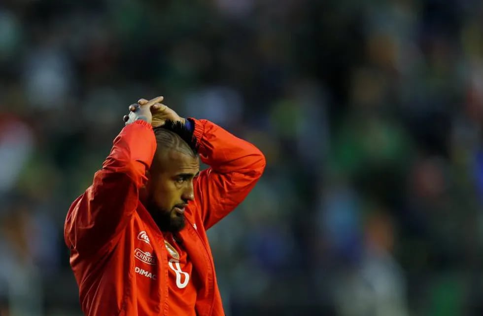 Chile's Arturo Vidal leaves the pitch after losing to Bolivia during a 2018 Russia World Cup qualifying soccer match at the Hernando Siles stadium in La Paz, Bolivia, Tuesday, Sept. 5, 2017. (AP Photo/Juan Karita)