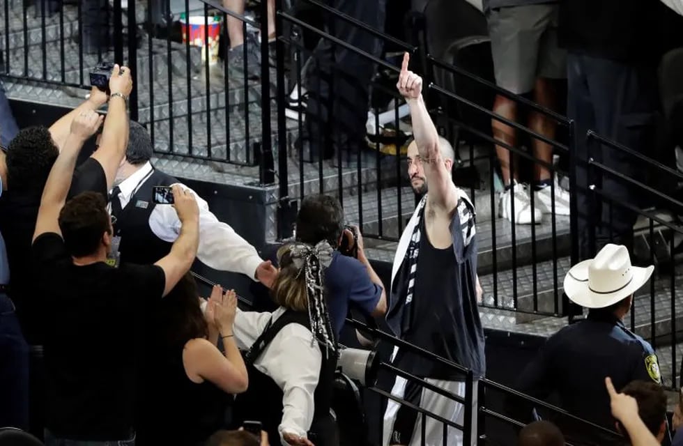 San Antonio Spurs guard Manu Ginobili (20) signals to fans as he walks off the court after Game 4 of the NBA basketball Western Conference finals against the Golden State Warriors, Monday, May 22, 2017, in San Antonio. Golden State won 129-115. (AP Photo/Eric Gay)