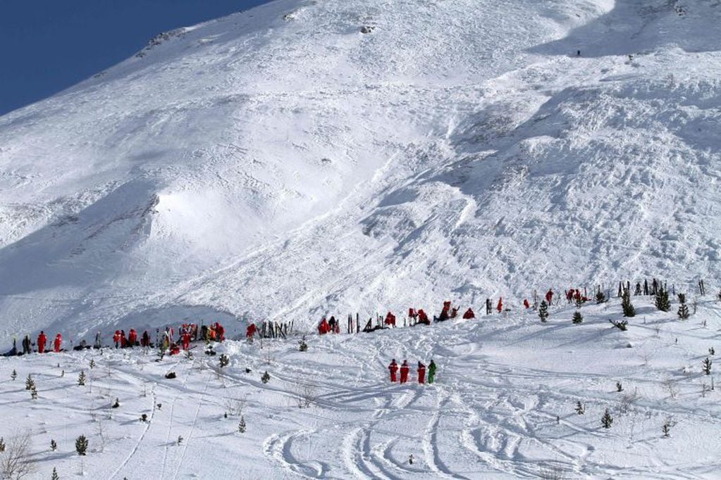 CORRECTION - (FILES) This file handout photo taken and realeased on February 13, 2017 and made available by Radio Val d'Isere in Tignes, in the French Alps shows an avalanche site in an off-piste area after an avalanche engulfed nine people, killing at le
