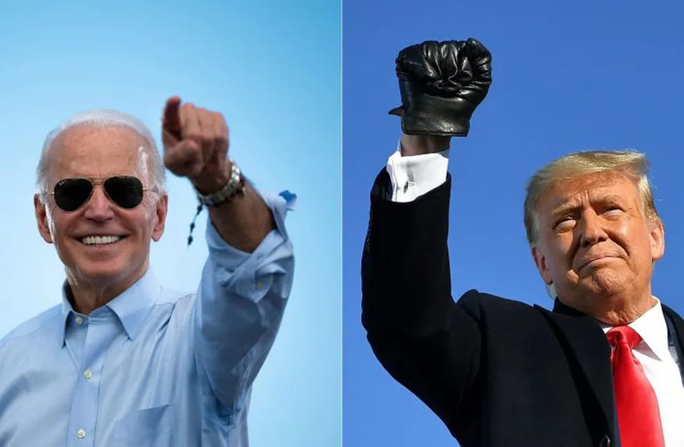 (FILES)(COMBO) This combination of pictures created on October 30, 2020 shows Democratic Presidential candidate and former US Vice President Joe Biden gestures prior to delivering remarks at a Drive-in event in Coconut Creek, Florida, on October 29, 2020 and US President Donald Trump pumps his fist as he arrives to a campaign rally at Green Bay Austin Straubel International Airport in Green Bay, Wisconsin on October 30, 2020. - President Donald Trump and Democrat Joe Biden fought November 2, 2020 through the eve of an election threatened by legal chaos and fears of violence after Trump, down in the polls and with only hours to go, pushed hard to discredit the US voting process.On Tuesday, the world will witness a country more divided and angry than at any time since the Vietnam War era of the 1970s. (Photos by JIM WATSON and MANDEL NGAN / AFP)