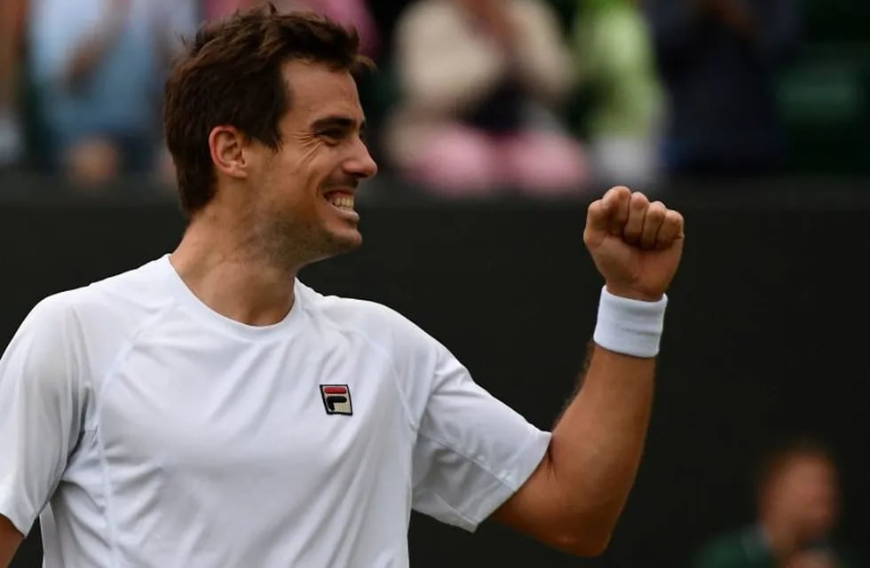 Argentina's Guido Pella celebrates after beating Canada's Milos Raonic during their men's singles fourth round match on the seventh day of the 2019 Wimbledon Championships at The All England Lawn Tennis Club in Wimbledon, southwest London, on July 8, 2019. (Photo by Daniel LEAL-OLIVAS / AFP) / RESTRICTED TO EDITORIAL USE