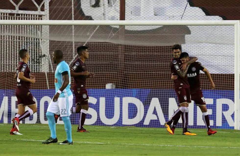 Soccer Football - Argentina's Lanus v Peru's Sporting Cristal - Copa Sudamericana - Ciudad de Lanus stadium, Buenos Aires, Argentina - February 21, 2018. Lanus' Alejandro Gonzalez celebrates with his teammates after scoring. REUTERS/Agustin Marcarian