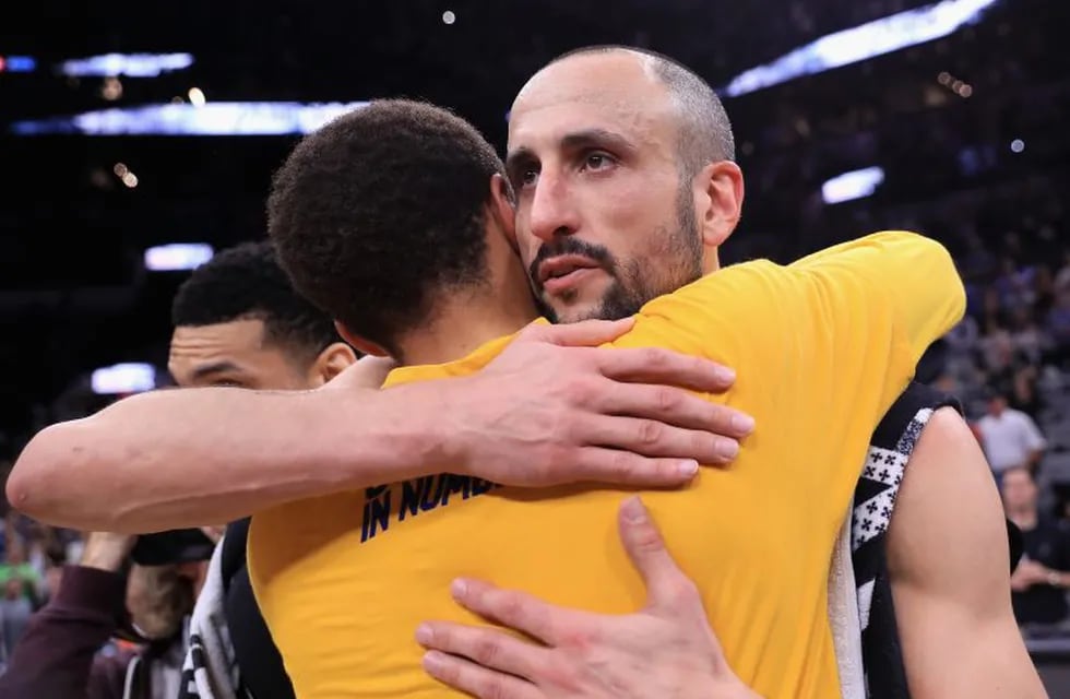 SAN ANTONIO, TX - MAY 22: Stephen Curry #30 of the Golden State Warriors hugs Manu Ginobili #20 of the San Antonio Spurs after the Golden State Warriors defeated the San Antonio Spurs 129-115 in Game Four of the 2017 NBA Western Conference Finals at AT&T Center on May 22, 2017 in San Antonio, Texas. The Golden State Warriors defeat the San Antonio Spurs 4-0 in the Western Conference Finals to advance to the 2017 NBA Finals. NOTE TO USER: User expressly acknowledges and agrees that, by downloading and or using this photograph, User is consenting to the terms and conditions of the Getty Images License Agreement.   Ronald Martinez/Getty Images/AFPn== FOR NEWSPAPERS, INTERNET, TELCOS & TELEVISION USE ONLY ==