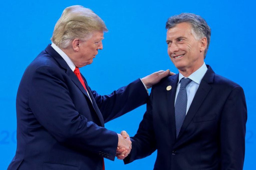 Mauricio Macri y Donald Trump (Photo by Ludovic MARIN / AFP)