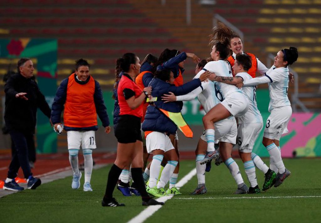 Soccer Football - XVIII Pan American Games - Lima 2019 - Women's Semi Finals - Paraguay v Argentina - San Marcos Stadium, Lima, Peru - August 6, 2019. Argentina's players celebrate. REUTERS/Susana Vera