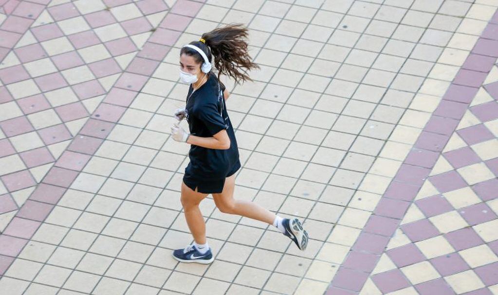 02 May 2020, Spain, Seville: A woman exercises outside at the Maria Luisa park after the imposed lockdown has been eased following weeks of mandatory quarantining amid the coronavirus pandemic. Photo: Eduardo Briones/Europa Press/dpa