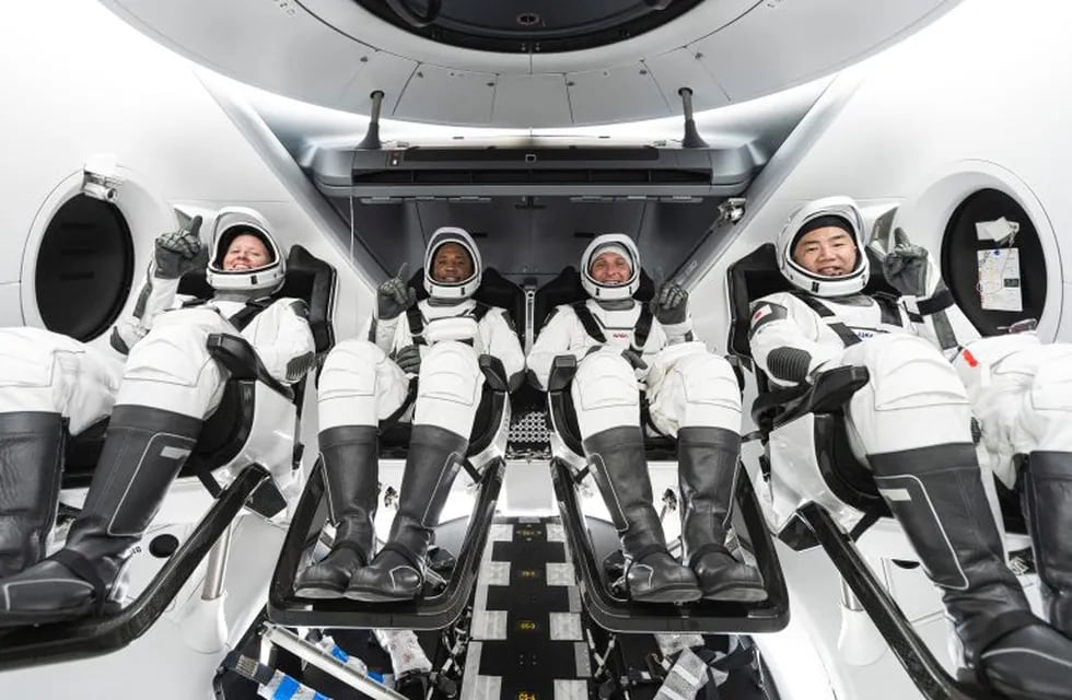 This undated photo made available by SpaceX in September 2020 shows, from left, NASA astronauts Shannon Walker, Victor Glover, commander Mike Hopkins and Japan Aerospace Exploration Agency astronaut Soichi Noguchi inside SpaceX's Crew Dragon spacecraft. The four are scheduled to be SpaceX’s second crew launch in mid-November 2020. (SpaceX via AP)