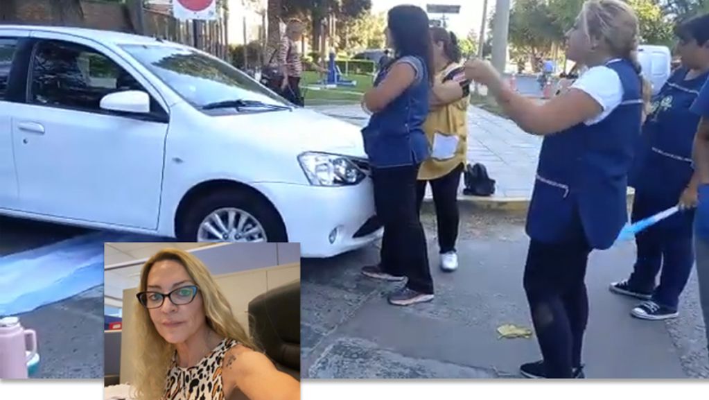 Momento en que la funcionaria Mónica Montemurro intenta atravesar entre las manifestantes docentes femeninas.