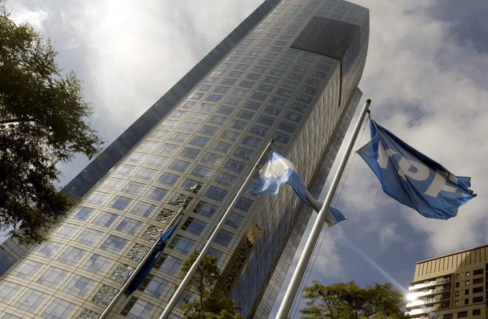 FILE PHOTO: FILE PHOTO: FILE PHOTO: The headquarters of Argentina's state-controlled energy company YPF is pictured in Buenos Aires April 16, 2015. The cost of drilling wells in Argentina's vast but barely-tapped Vaca Muerta shale oil and gas formation will fall at least 10 percent by the end of 2016, Miguel Galuccio, chief executive officer of state energy company said on Thursday.  REUTERS/Enrique Marcarian/File Photo/File Photo/File Photo
