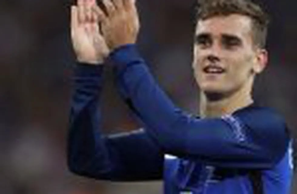 FILE - In this Thursday, July 7, 2016 file photo, France's Antoine Griezmann celebrates after the Euro 2016 semifinal soccer match between Germany and France, at the Velodrome stadium in Marseille, France. Antoine Griezmann is the new challenger to Lionel Messi and Cristiano Ronaldo for FIFA's annual player award.nFIFA says the France forward is on a three-man shortlist for the rebranded Best Player Award. (AP Photo/Thanassis Stavrakis, File)