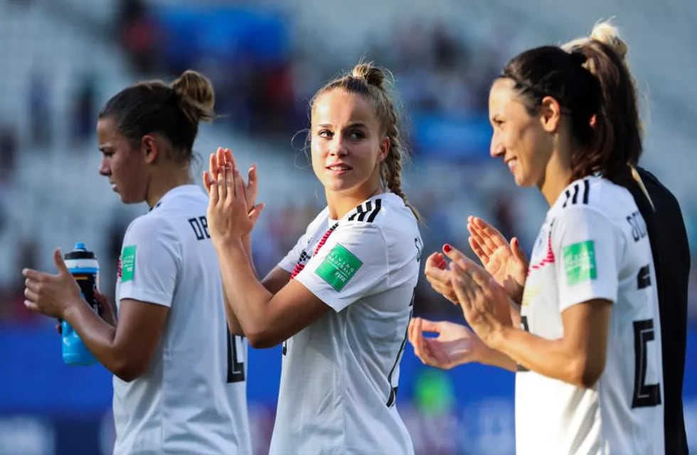 Germany players celebrate at the end of the Women's World Cup round of 16 soccer match between Germany and Nigeria at Stade del Alpes in Grenoble, France, Saturday, June 22, 2019. Germany won 3-0. (AP Photo/Laurent Cipriani)