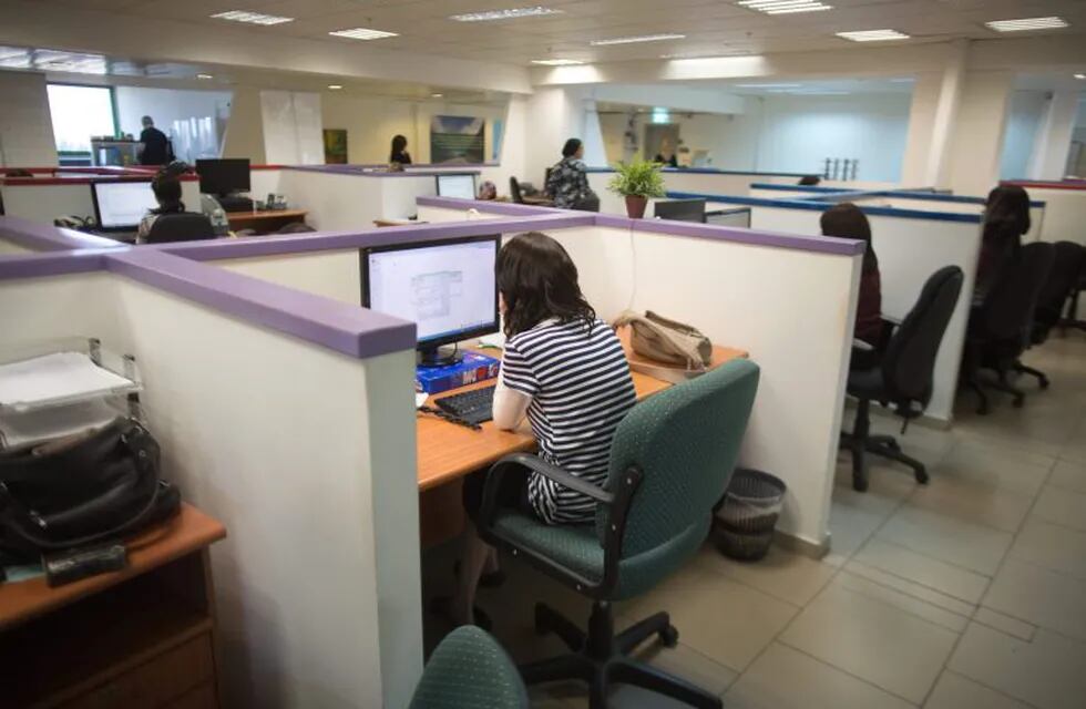 Ultra-Orthodox Jewish women work on computers at their desks in the Comax software company office in the central city of Holon near Tel Aviv on April 17, 2016. \r\nThe company in Holon near Tel Aviv employs 20 ultra-Orthodox women, one of several to do so as increasingly more female breadwinners from Israel's religious community join the secular work force. Graduates of programming schools in the overwhelmingly ultra-Orthodox community of Bnei Brak, about 10 kilometres (six miles) away, the Comax women produce most of the firm's computer programmes for large supermarkets in the vicinity.\r\n\r\n\r\n\r\n\r\n\r\n / AFP PHOTO / MENAHEM KAHANA / TO GO WITH AFP STORY BY DELPHINE MATTHIEUSSENT israel holon  israel mujeres trabajando en empresa informatica Comax mujeres judias ultra ortodoxas trabajando trabajo trabajadores