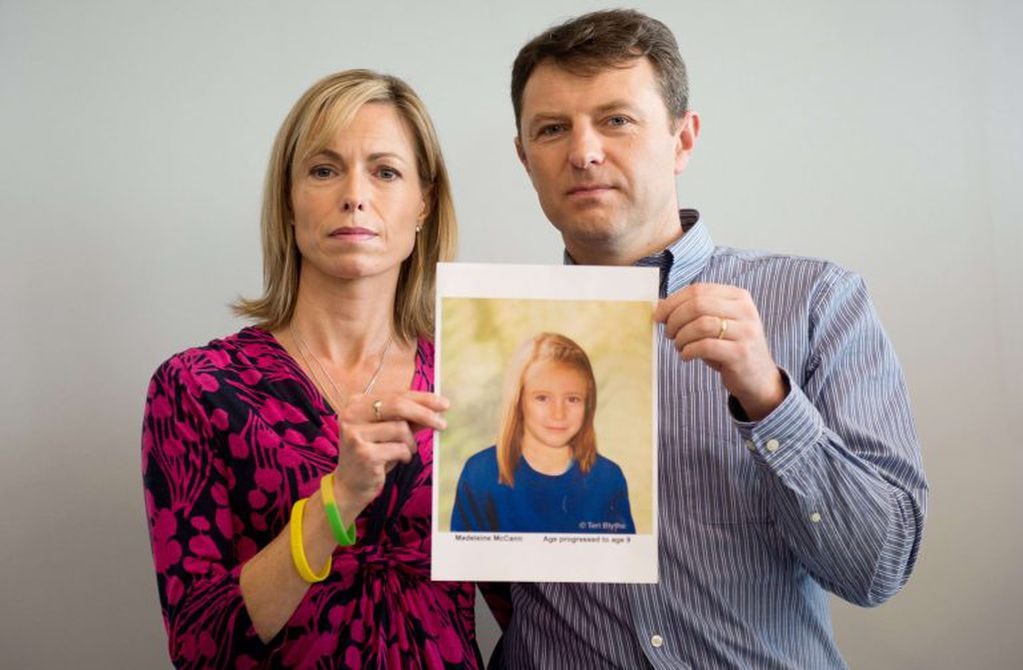(FILES) In this file picture taken on May 2, 2012 parents of missing girl Madeleine McCann, Kate (L) and Gerry McCann (R) pose with an artist's impression of how their daughter might look now at the age of nine ahead of a press conference in central Londo