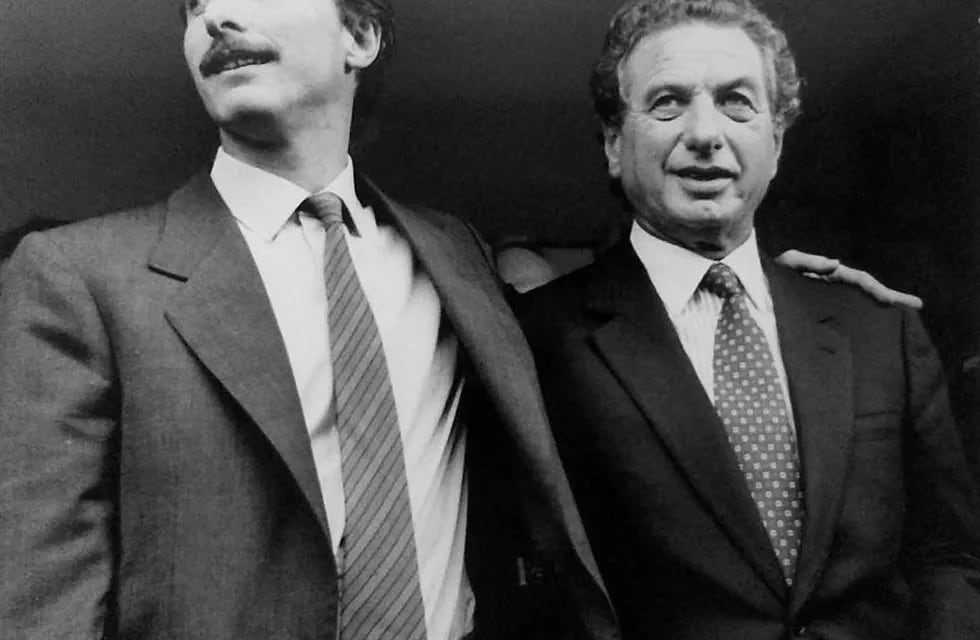 FILE PHOTO: Tycoon Franco Macri (R), hugs his son, Mauricio Macri, after he was released, after being kidnapped in Buenos Aires, Argentina, September 6, 1991. REUTERS/ File Photo