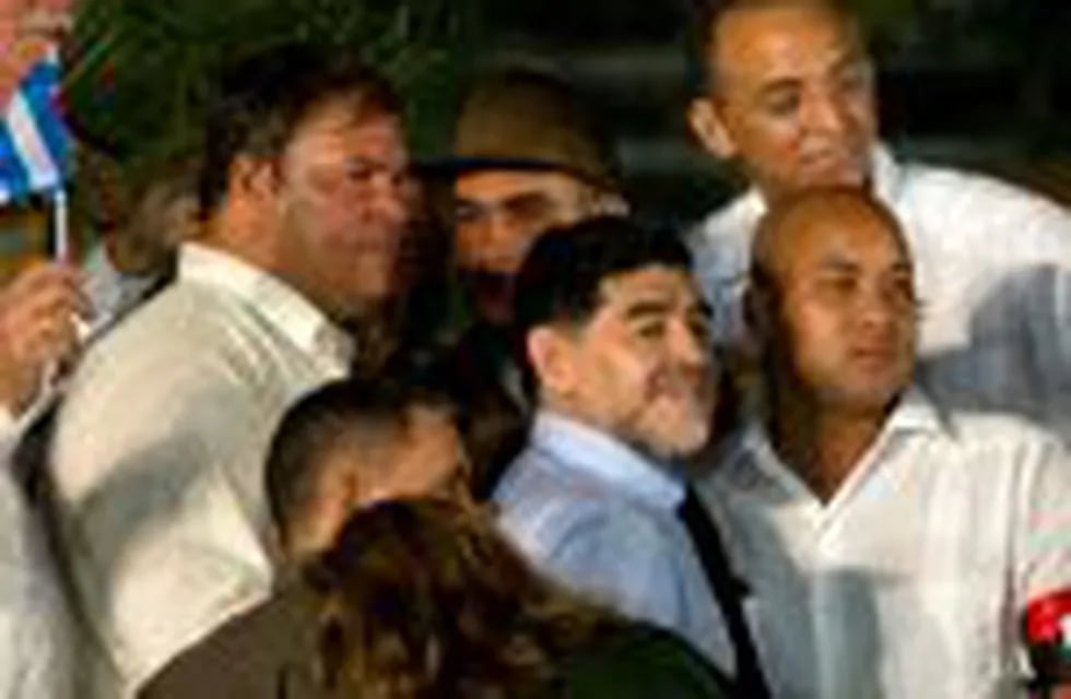 Argentina's soccer legend Diego Armando Maradona, center, stands on the stage after a rally honoring late Cuban leader Fidel Castro at Antonio Maceo plaza in Santiago, Cuba, Saturday, Dec. 3, 2016. After a four-day journey across the country through small