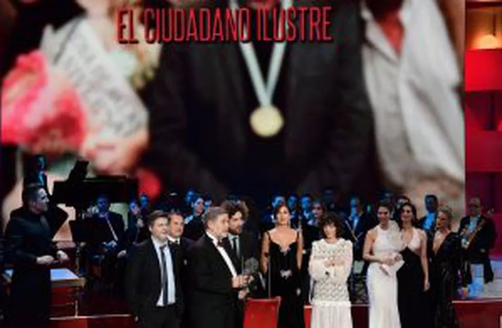 Argentinian film director Gaston Duprat (L), Argentinian film director Mariano Cohn (4L) and other crew members receive the best Latin-American film award for 'El ciudadano ilustre' (The distinguised citizen) at the 31st Goya awards ceremony in Madrid on 