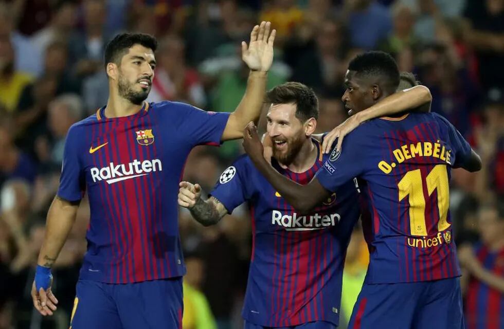 Soccer Football - FC Barcelona vs Juventus - Camp Nou, Barcelona, Spain - September 12, 2017   Barcelona’s Lionel Messi celebrates scoring their third goal with Luis Suarez (L) and Ousmane Dembele (R)     REUTERS/Susana Vera     TPX IMAGES OF THE DAY