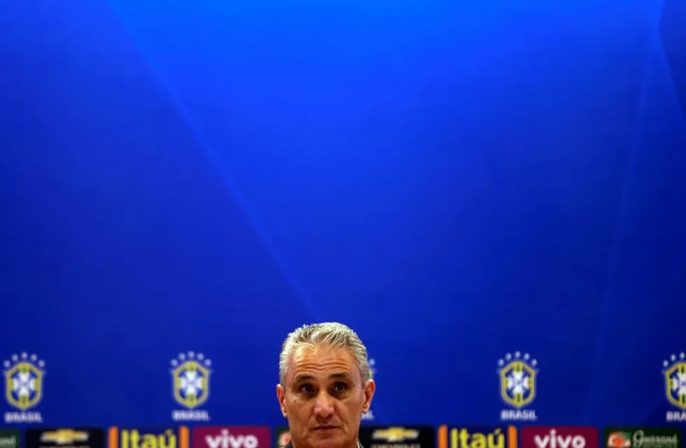 Football Soccer - 2018 World Cup - Brazil's News conference - Brazilian Football Confederation (CBF) headquarters, Rio de Janeiro, Brazil - 21/10/16 - Brazilian national team head coach Tite listens to journalists during a news conference to announce the Brazilian national team which will play against Argentina and Peru in their upcoming 2018 World Cup qualifying matches. REUTERS/Pilar Olivares