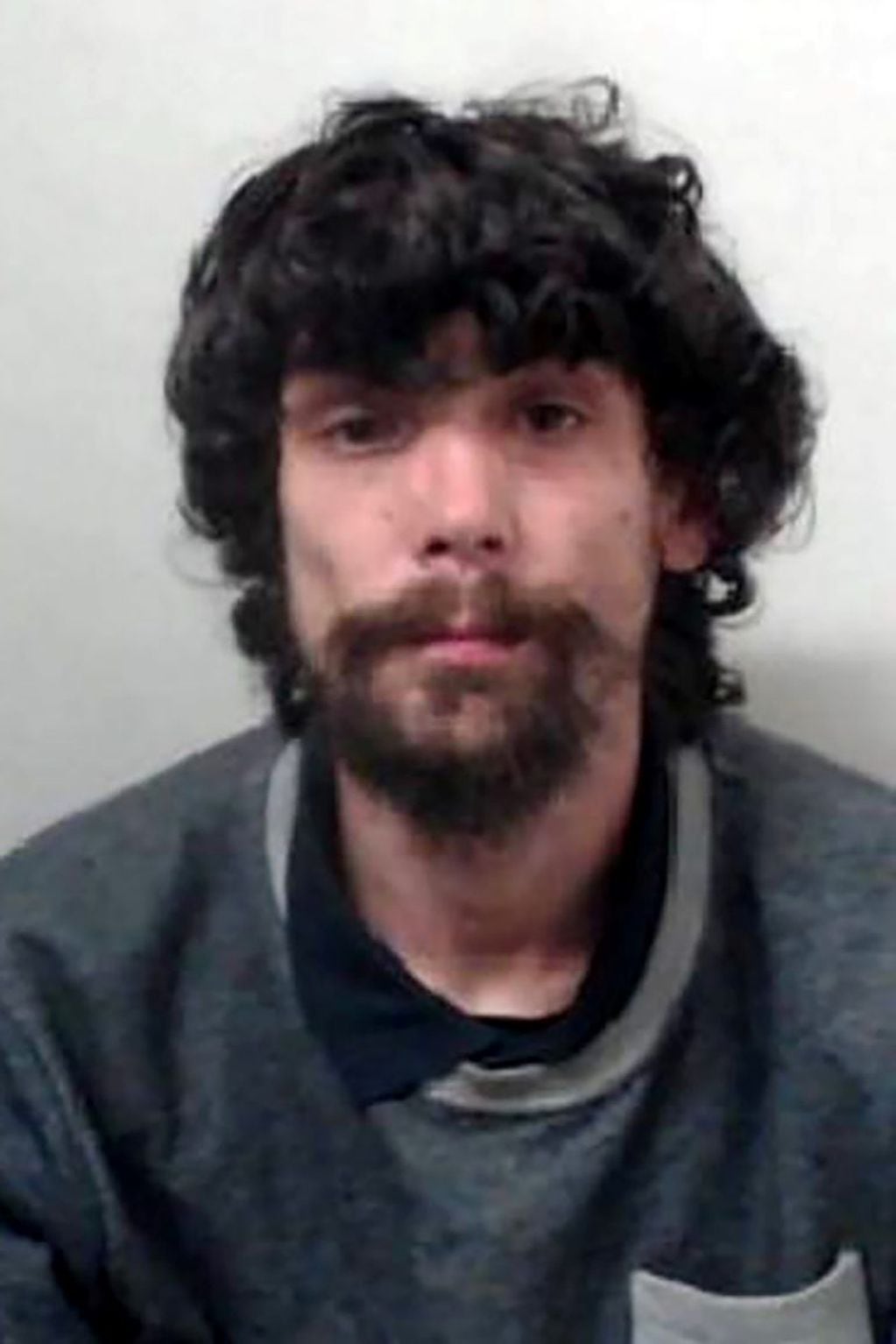 A handout picture released by the Greater Manchester Police (GMP) on January 30, 2018, shows the custody photograph of Christopher Parker who was was sentenced to four years and three months after pleading guilty to theft, fraud and breaching his bail at Manchester Crown Square Court on January 30, 2018.
A homeless man hailed as a hero for apparently coming to the aid of victims of the Manchester Arena terror attack was jailed for more than  four years Tuesday after admitting to actually robbing them. / AFP PHOTO / GREATER MANCHESTER POLICE / HO