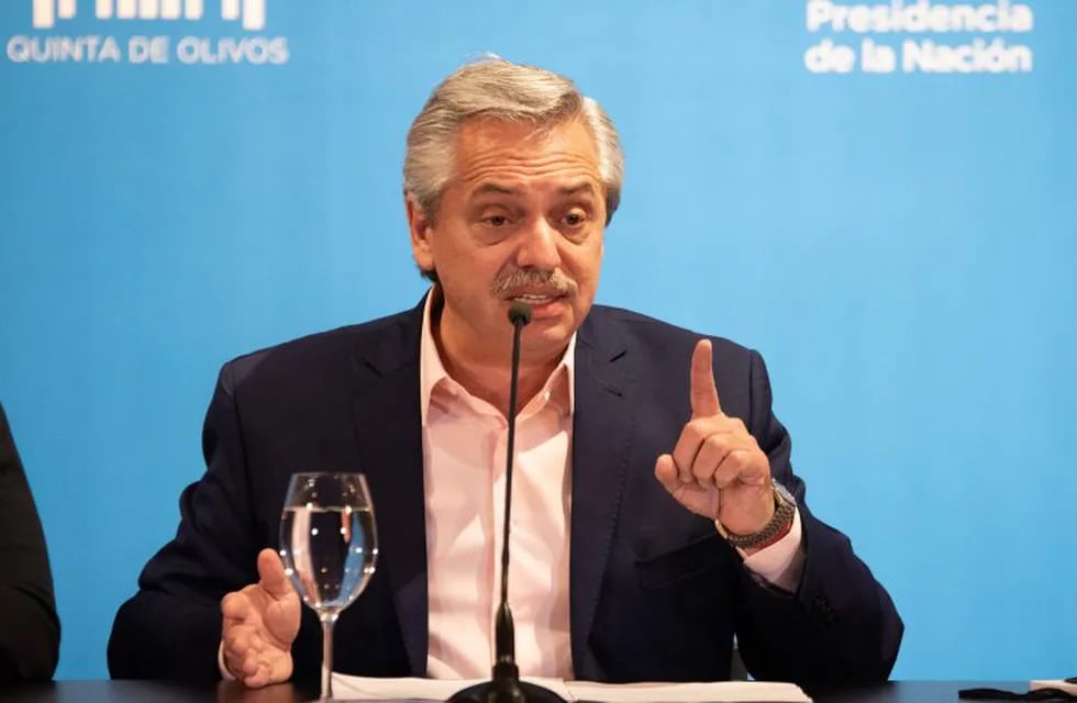 Argentina's President Alberto Fernandez talks to press after an inter-ministerial committee regarding the new coronavirus, COVID-19, at Presidential residence in Olivos, Buenos Aires on March 15, 2020. (Photo by STR / AFP)