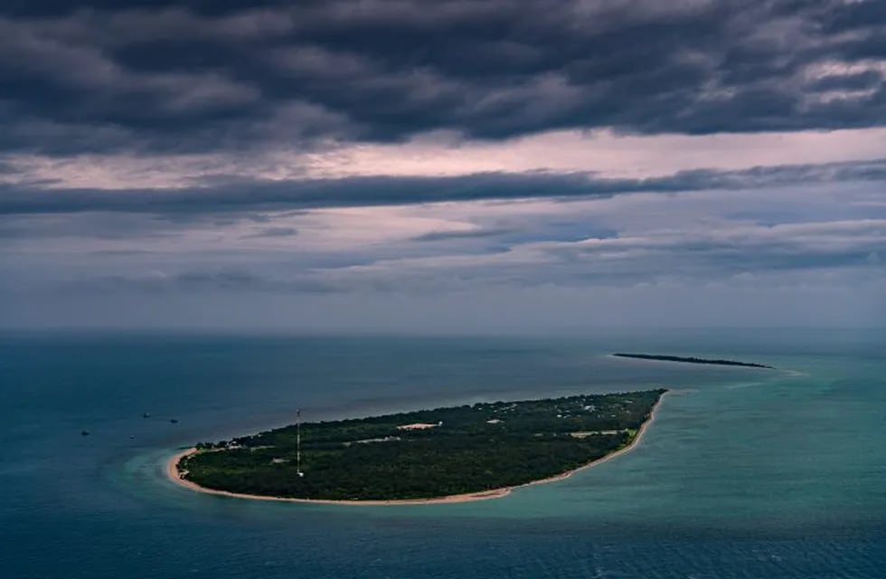 2ad634b7-ff3c-4a21-b287-ebc4b739421c|As climate change pushes the tides higher, Masig Island, like all of the Torres Strait Islands, is at risk of vanishing. (Matthew Abbott for The New York Times)