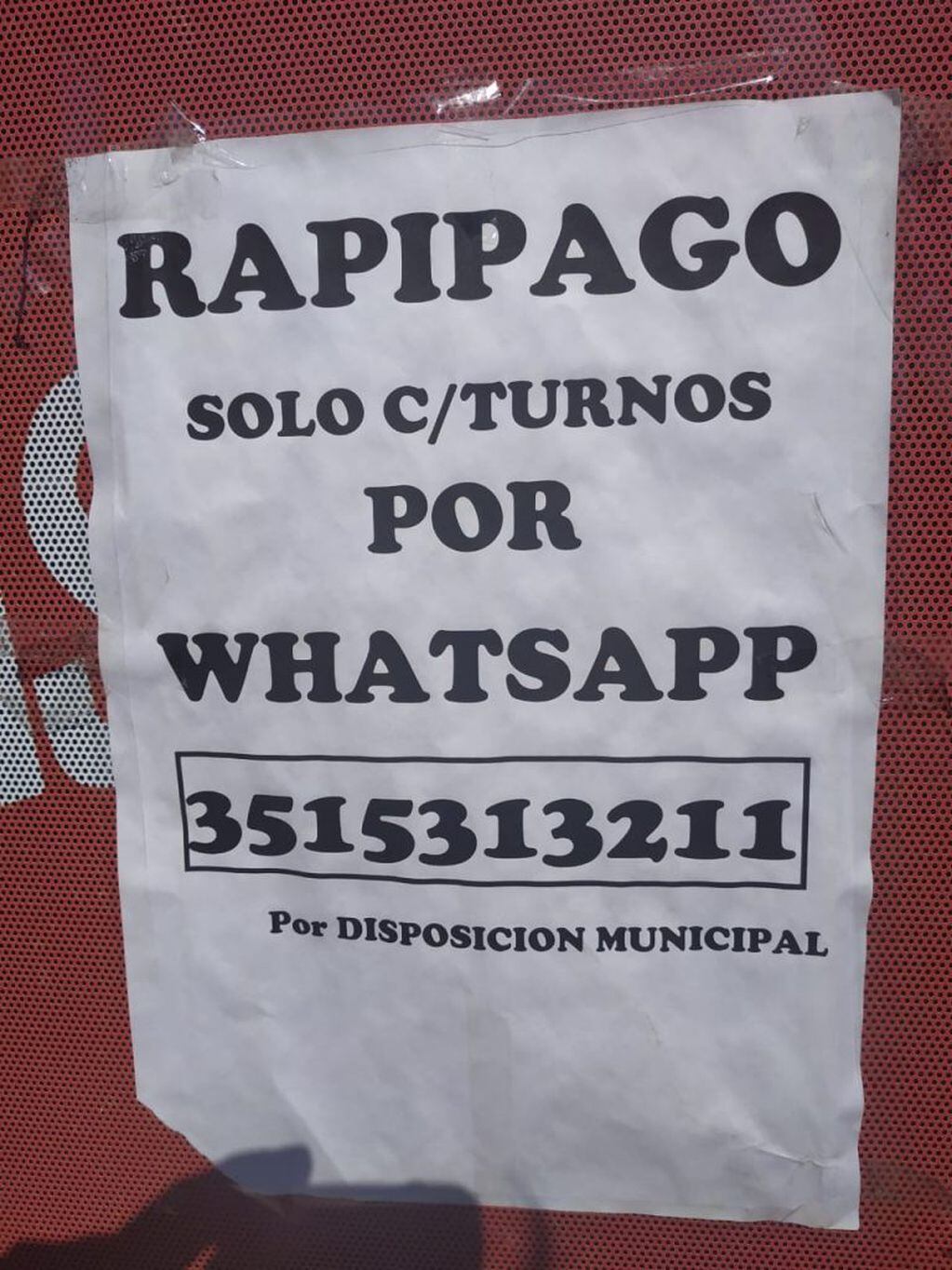 Letrero del teléfono de turno Rapi Pago