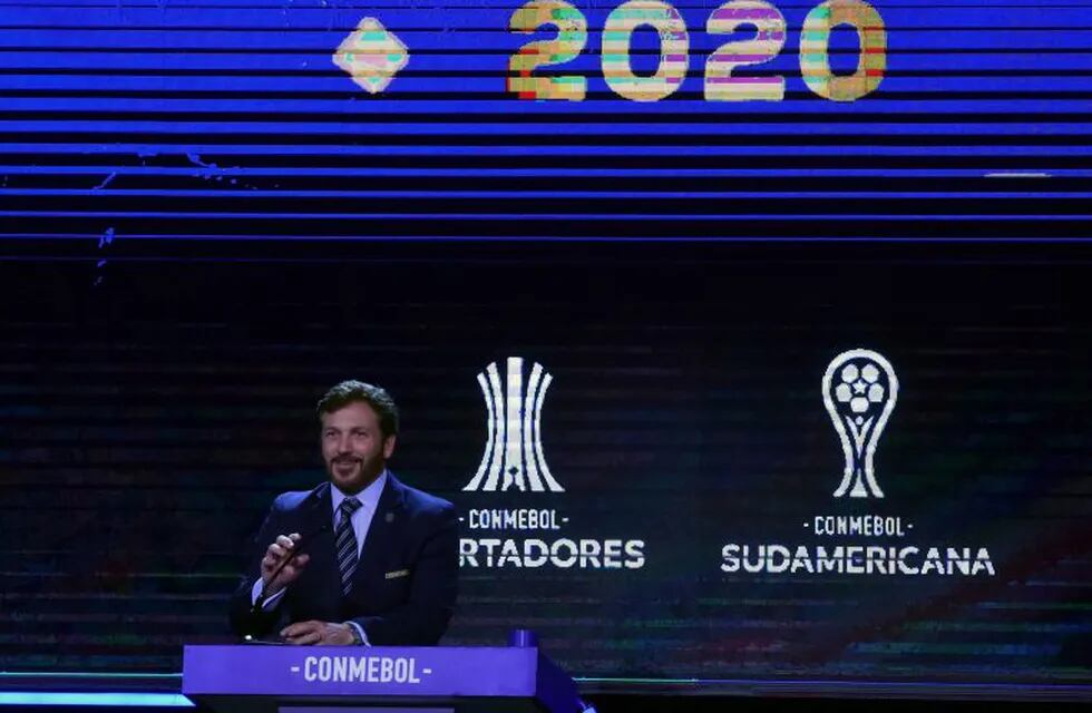 (FILES) In this file photo taken on December 17, 2019 the president of the South American Football Confederation (Conmebol), Paraguayan Alejandro Dominguez, speaks during the Copa Libertadores and Copa Sudamericana draw at the Conmebol headquarters in Luque, Paraguay. - Conmebol set on July 10, 2020 the restart of the Copa Libertadores for September 15 and the Copa Sudamericana for October 27, after they were suspended due to the new coronavirus pandemic, \