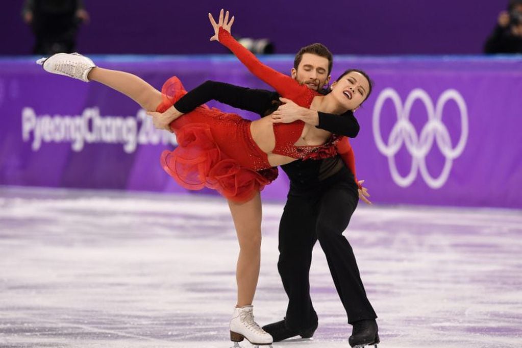 South Korea's Alexander Gamelin and South Korea's Yura Min compete in the ice dance short dance of the figure skating event during the Pyeongchang 2018 Winter Olympic Games at the Gangneung Ice Arena in Gangneung on February 19, 2018. / AFP PHOTO / Mladen ANTONOV