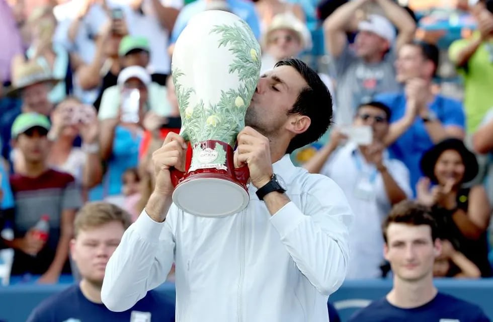 MASON, OH - AUGUST 19: Novak Djokovic of Serbis celebrates his win over Roger Federer of Switzerland during the men's final of the Western & Southern Open at Lindner Family Tennis Center on August 19, 2018 in Mason, Ohio.   Matthew Stockman/Getty Images/AFP\n== FOR NEWSPAPERS, INTERNET, TELCOS & TELEVISION USE ONLY ==